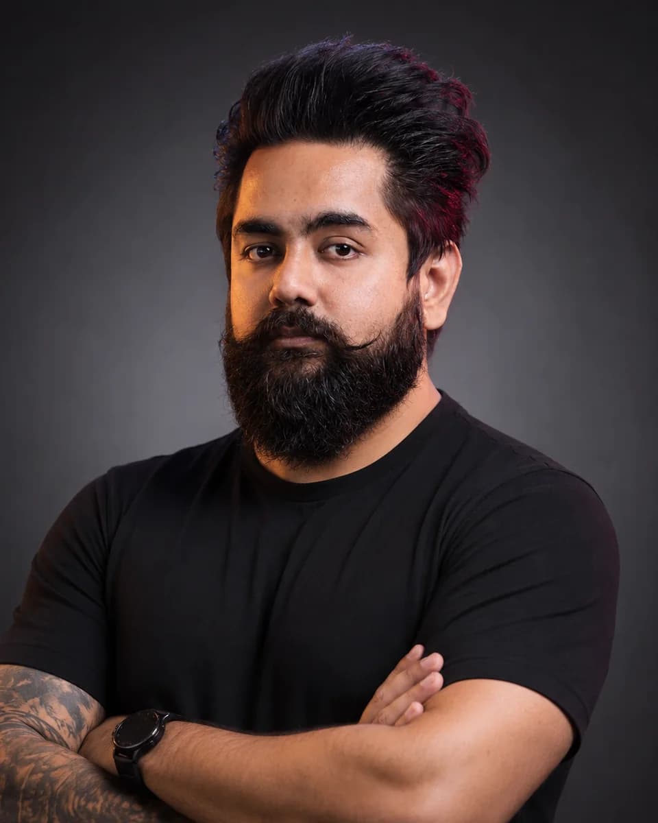 Vishal Nigam, founder of WTF Gyms, in a black tee with arms crossed